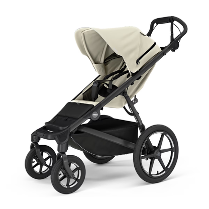 Thule Urban Glide 3 Kinderwagen in Creme – eleganter Sport- und All-Terrain-Kinderwagen mit drehbarem Vorderrad, großem Verdeck und geräumigem Stauraumkorb für aktive Familien
