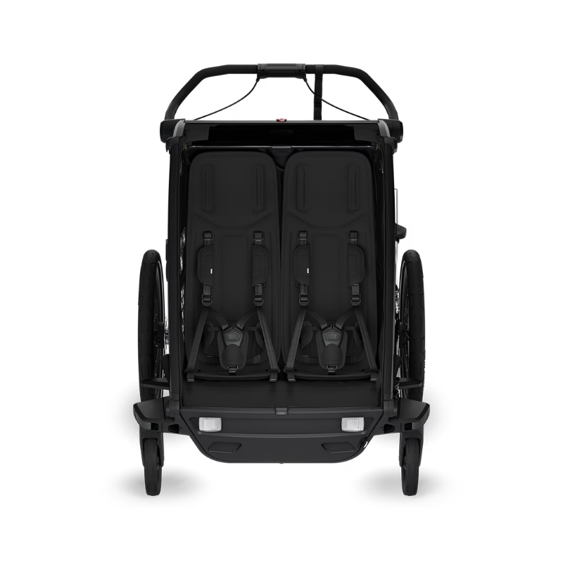 Thule Chariot Kinderfahrradanhänger für zwei Kinder – Innenansicht mit gepolsterten Sitzen, 5-Punkt-Gurten und ergonomischem Design