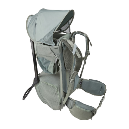 Thule Kindertrage in Grün mit integriertem Sonnenschutz – ergonomische Rückentrage für Kinder mit Belüftungssystem, verstellbaren Gurten und stabilem Aluminiumrahmen