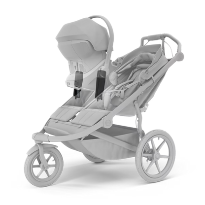 Thule Doppelkinderwagen mit montierten schwarzen Autositz Adaptern mit Babyschale