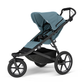 Thule Urban Glide 3 Kinderwagen in Mid Blue, Seitenansicht mit großem Verdeck, Dreirad-Design und Stauraumkorb.