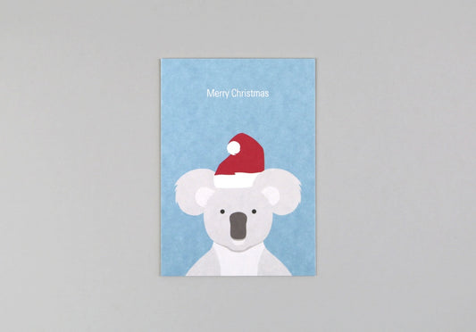 Produktbild: KunstanPapier - Merry Christmas Koala Postkarte von KunstanPapier im Onlineshop von dasMikruli - Dein Shop für Baby Erstausstattung