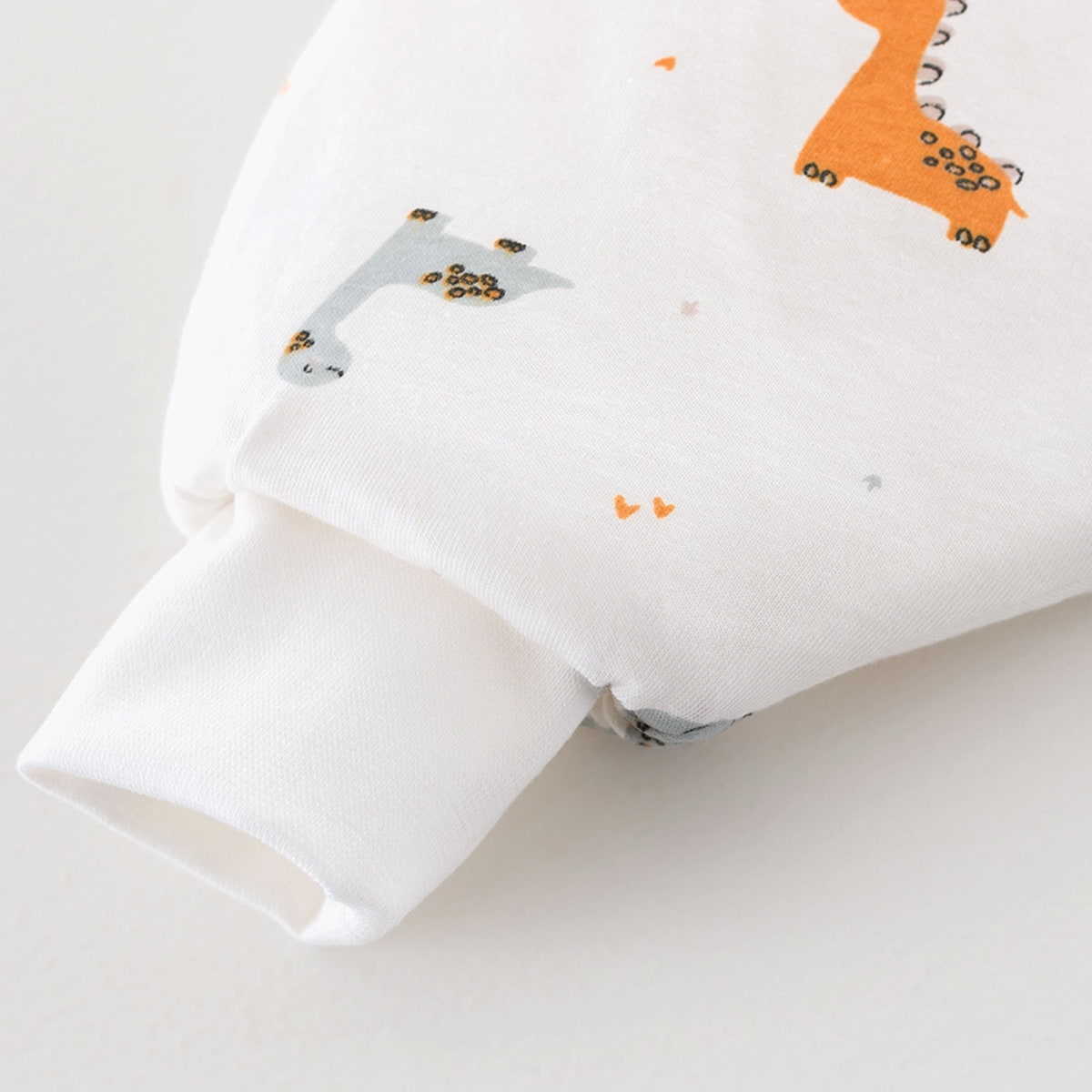 Produktbild: Ganzjahres-Schlafsack TO GO Dinolino von Träumeland im Onlineshop von dasMikruli - Dein Shop für Baby Erstausstattung